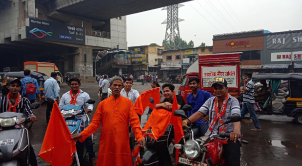 Supporters of the rival Shiv Sena Party’s Dilip Lande make a bright splash of colour on the roads.
